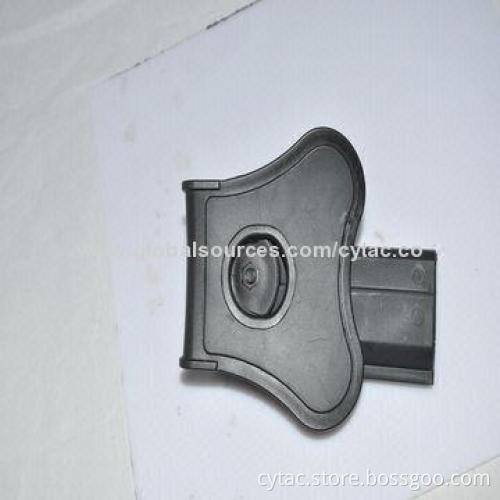 1911 pistol holster, polymer, designed with release button, soft silicone paddle